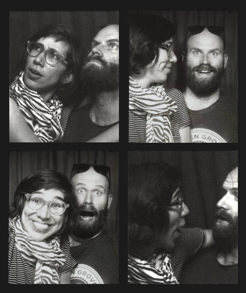 Black-and-white photobooth strip of Cordelia and John admiring each other